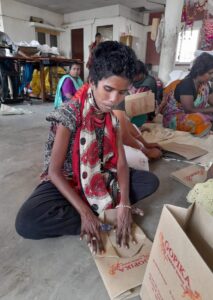 Woman working on a paper bag