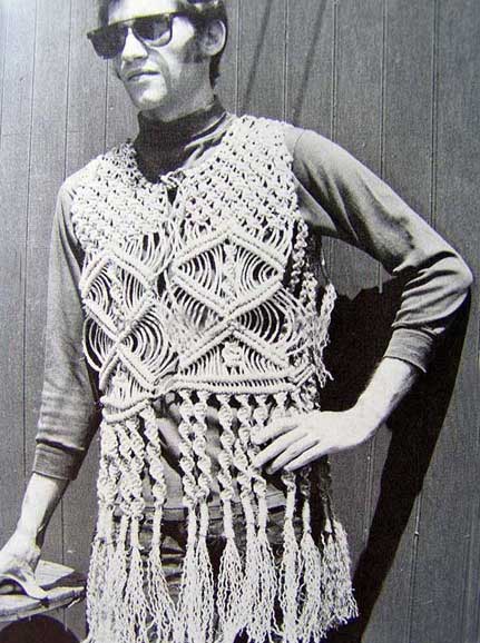 Black and white photograph of man wearing a macrame vest