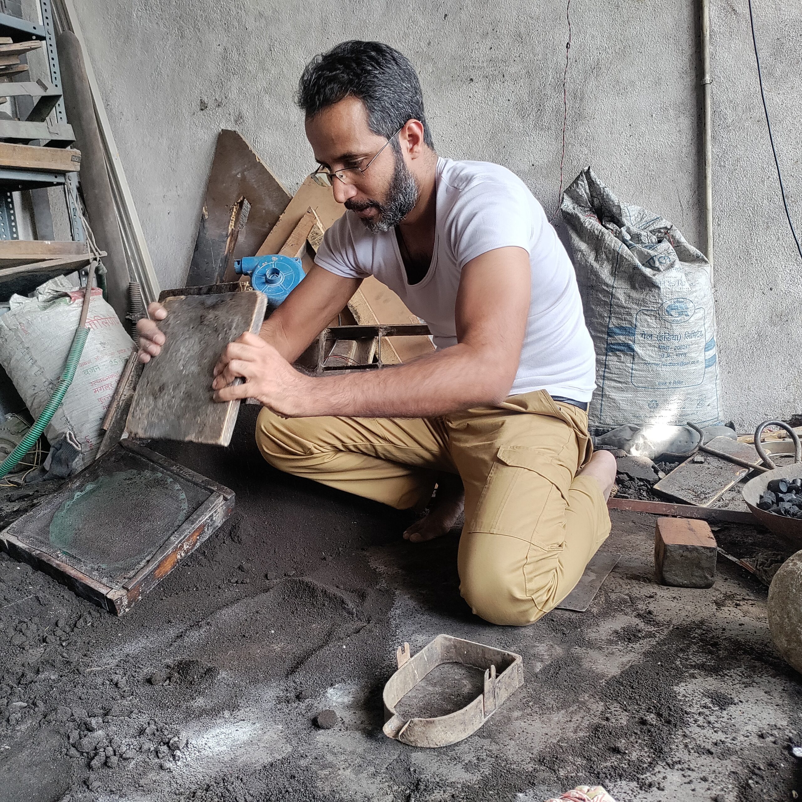 Taher Siddiqui in his studio, working on Bidri craft of India