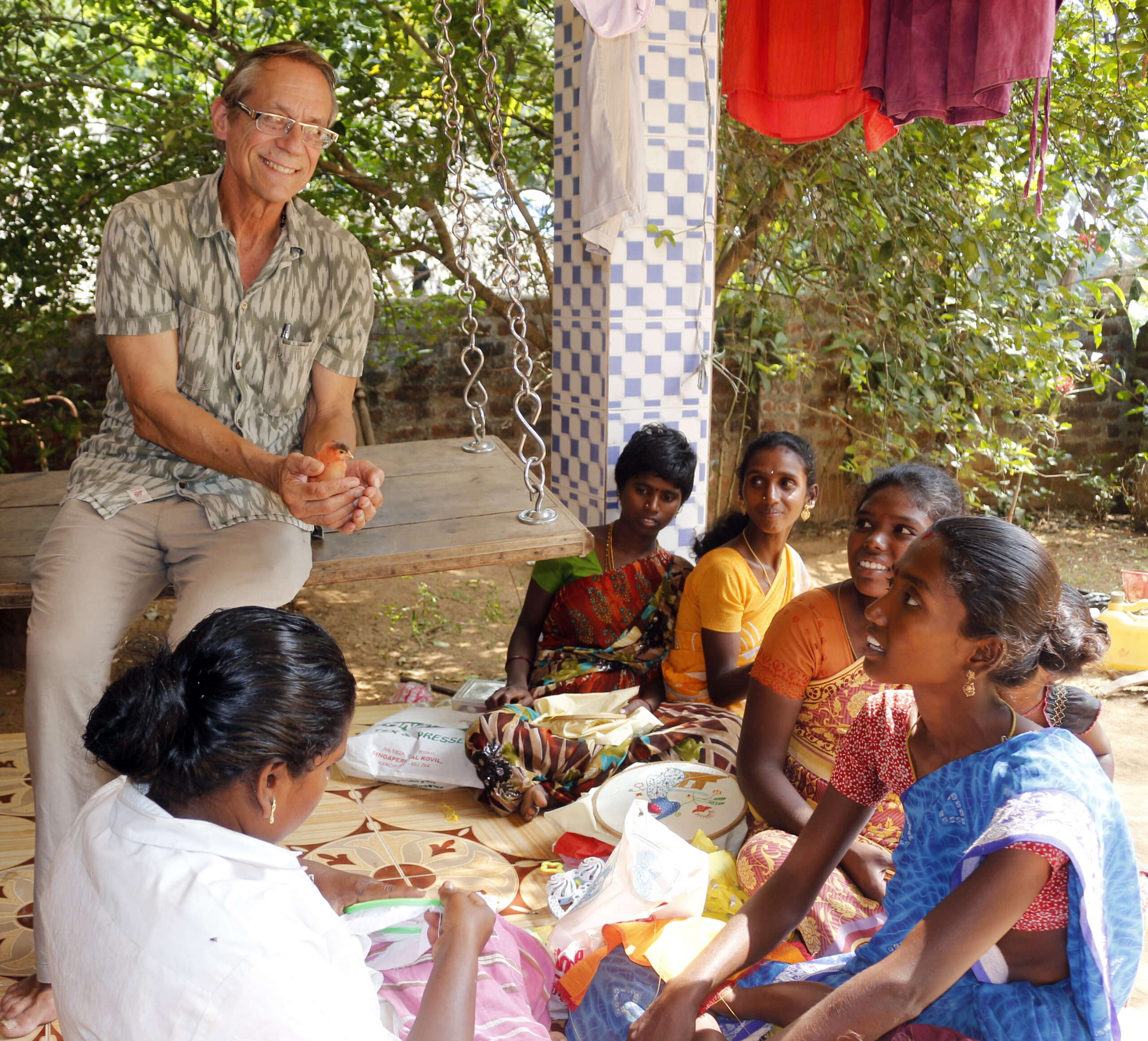Women of the livelihood project interact with founder John Degler